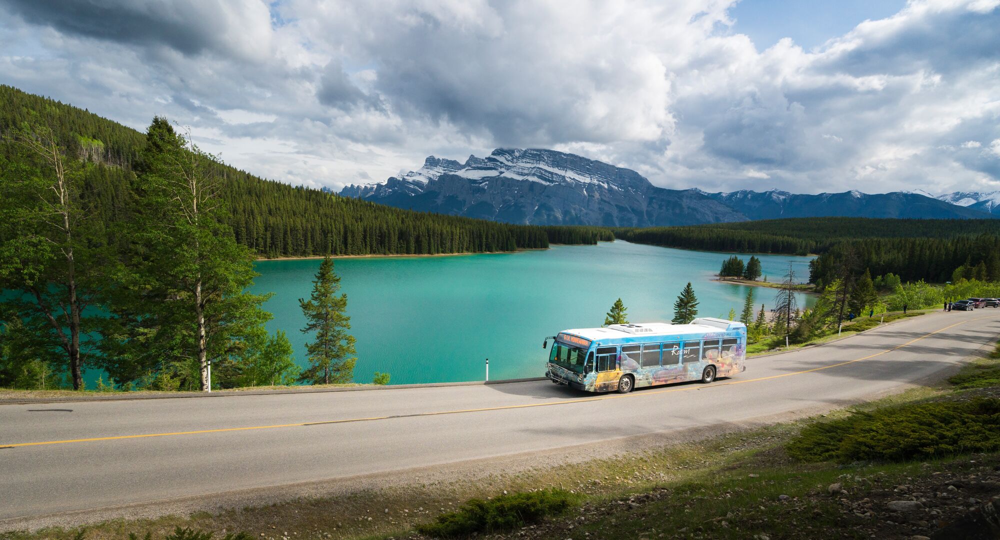 The perfect captured of a Roam Transit shuttle passing the Two Jack Lake.